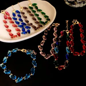 Detailed view of colorful zircon teardrop bracelets in various vibrant shades