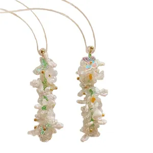 Elegant handmade floral beaded drop earrings with Monet-inspired iridescent accents.