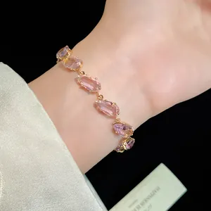 Detailed view of elegant pink water drop zircon bracelet worn on a woman's wrist