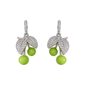 Elegant silver-tone apple drop earrings with green enamel and sparkling cubic zirconia