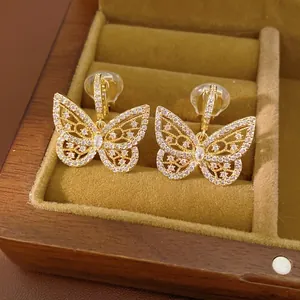 18K gold plated butterfly clip earrings with sparkling zircons in a jewelry box