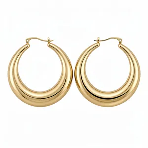Chunky gold-tone hoop earrings with a polished metallic finish and hollow circular design