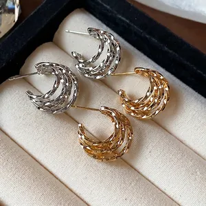 Minimalist 18k gold plated C-shaped hoop earrings with a stylish multi-layered twisted design
