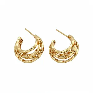 Elegant 18k gold plated C-shaped twisted layered stud earrings with silver needles.