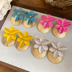 Vibrant vacation style flower earrings with golden pleated texture in multiple colors