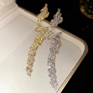 Elegant luxury gold and silver long leaf wrap opening ring with sparkling marquise zircons