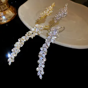 Detailed view of elegant leaf-shaped rings with sparkling marquise-cut zircons.