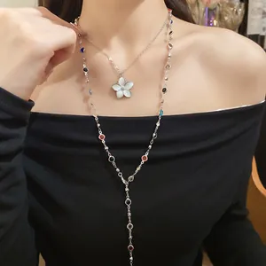 Close-up of a retro double-layer necklace with colorful crystal beads and flower pendant
