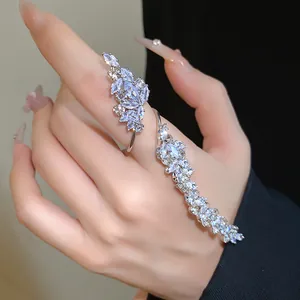 Close-up detail of silver-tone leaf open ring with marquise cut sparkling zircons