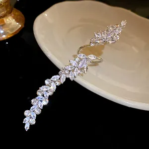 Close-up of elegant leaf pattern zirconia encrusted silver open ring with vintage luxury style