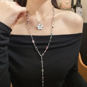 Detailed shot of double layered necklaces with flower pendant and colorful beads