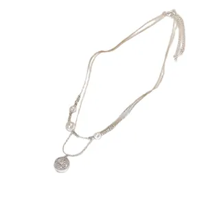 Elegant double-layered compass star necklace with sparkling zircons and white pearls