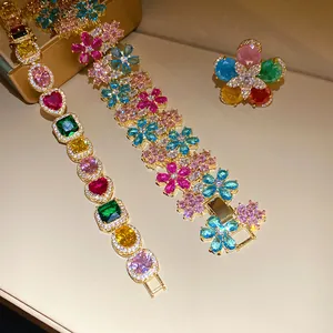 Detailed view of colorful zircon flower ring and multi-gemstone gold plated bracelets