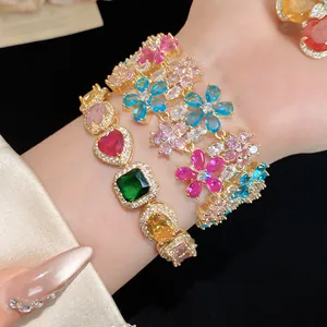 Detailed shot of 18k gold plated bracelets featuring colorful flower and heart zircons