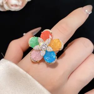 Detailed macro view of 18k gold plated zircon flower ring with vibrant colorful petals