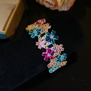 Close-up of elegant 18k gold plated zircon flower ring with colorful crystals