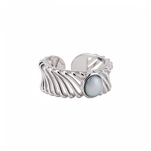 Elegant silver open ring featuring an oval cat eye stone and hollow band design