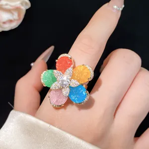 Close-up of 18k gold plated colorful flower ring with sparkling zircons and crystals