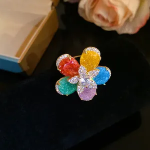 Detailed macro shot of an 18k gold plated flower ring with colorful zircon stones