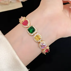 Detailed shot of an elegant gold-plated bracelet featuring vibrant multi-colored zircon stones