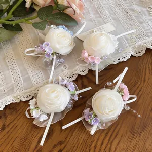 Four elegant chiffon rose duckbill hair clips with pastel floral accents on lace