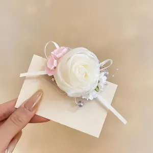 Elegant white chiffon rose hair clip with delicate pearl accents and pink flower.