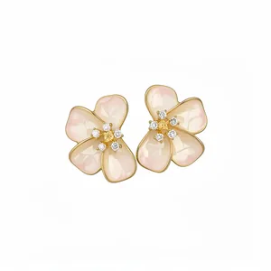 Elegant pink enamel flower stud earrings with CZ stone centers on plain white background