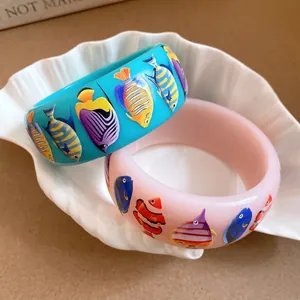 Bohemian style wide resin bangles with colorful tropical fish print for summer vacation