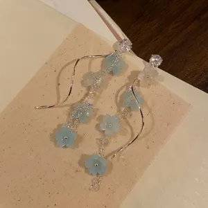 Elegant long zircon floral tassel earrings with blue flower dangles and silver wavy lines