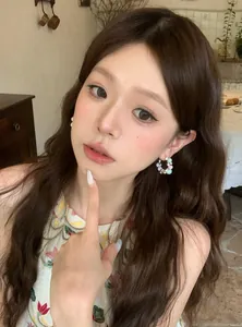 Model wearing elegant French style colorful pearl zircon hoop earrings for women