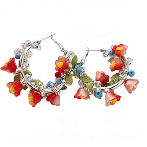 Vibrant floral hoop earrings with colorful glass beads and silver-tone finish.
