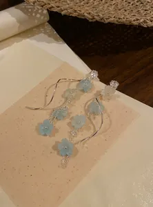 Long blue flower tassel earrings with sparkling zircon studs for an elegant fairy look.