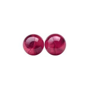 Elegant translucent red resin ball stud earrings with glossy finish on white background