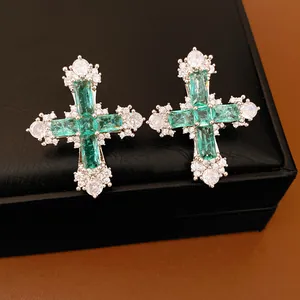 Luxurious emerald green gemstone cross earrings with sparkling cubic zirconia accents