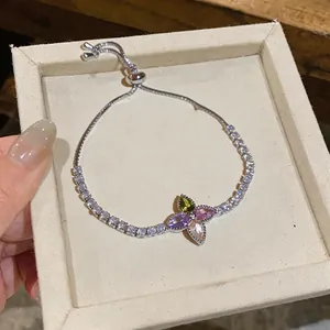 Exquisite silver-tone flower bracelet with colorful zircons displayed in a jewelry box