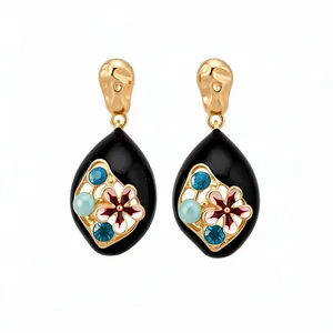 Orecchini vintage a goccia in oro con smalto nero e fiori di cristallo blu