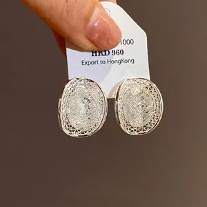 Elegant silver hollow mesh oval stud earrings for women with French style