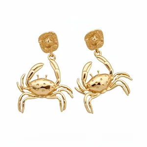 Fashionable gold-tone metallic crab dangle earrings with textured star stud detail