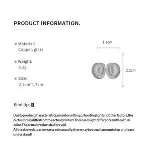 Product specification detail showing dimensions and materials of hollow oval stud earrings
