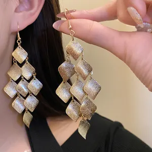 Elegant matte gold rhombic tassel drop earrings featuring a vintage minimalist aesthetic