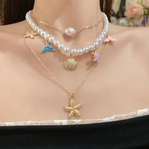 Elegante collana di perle a strati con ciondoli a forma di stella marina e coda di pesce