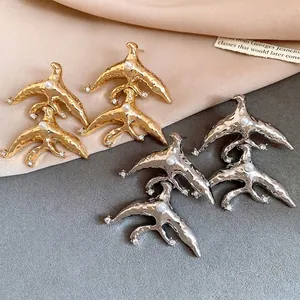Vintage bird-shaped earrings with pearls and rhinestones in gold and silver finish