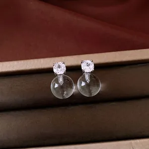 Elegant silver needle stud earrings with cubic zirconia and clear round bead charms
