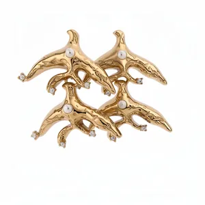 Vintage luxury gold bird-shaped earrings featuring central pearls and sparkling rhinestone accents