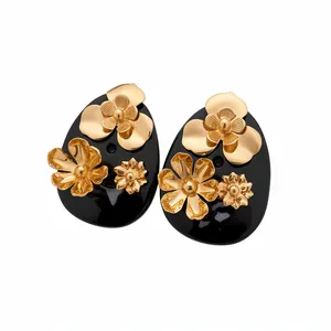 Vintage style black resin flower stud earrings with gold floral accents