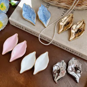 Vintage metallic leaf stud earrings with organic textures in multiple colors for women