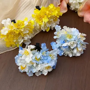 Set of elegant fabric flower hair clips in blue and yellow, sweet holiday style headwear