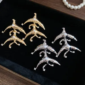 Vintage melted geometric dangle earrings with pearls and crystals in gold and silver finish.