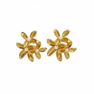 Elegant gold floral stud earrings with delicate central pearls in French vintage style
