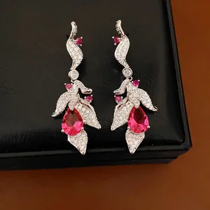 Elegant silver needle leaf earrings with sparkling zircons and pink teardrop stones